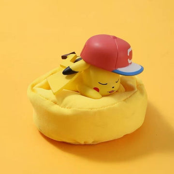Pokémon Starry Dream Sleeping Series figure of Pikachu in a red cap sleeping on a yellow cushion